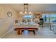 Dining area with table and chairs near kitchen and slider at 3779 Copperspring Blvd, New Port Richey, FL 34653