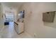 Bright hallway with white console table and decor at 3779 Copperspring Blvd, New Port Richey, FL 34653