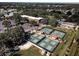 Aerial view of community tennis courts and clubhouse at 401 Dorchester Pl # 52, Sun City Center, FL 33573