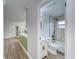 Updated bathroom with green accent wall, toilet, and shower/tub combo at 401 Dorchester Pl # 52, Sun City Center, FL 33573