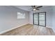 Bedroom with sliding glass doors leading to a patio at 401 Dorchester Pl # 52, Sun City Center, FL 33573