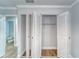 Spacious bedroom closet with built-in shelving and bifold doors at 401 Dorchester Pl # 52, Sun City Center, FL 33573