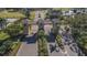 Gated entrance to community with palm trees and landscaping at 401 Dorchester Pl # 52, Sun City Center, FL 33573