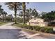 Kings Point South community entrance with lush landscaping at 401 Dorchester Pl # 52, Sun City Center, FL 33573