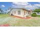 Single-story home with manicured lawn and attractive landscaping at 401 Dorchester Pl # 52, Sun City Center, FL 33573