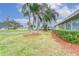 Tan single story home with neatly trimmed hedges at 401 Dorchester Pl # 52, Sun City Center, FL 33573