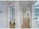 Hallway with light gray walls and wood-look floors at 401 Dorchester Pl # 52, Sun City Center, FL 33573
