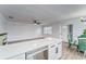 Kitchen features white cabinets, quartz countertops, and stainless steel dishwasher at 401 Dorchester Pl # 52, Sun City Center, FL 33573