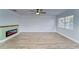 Living room with wood floors, fireplace, and natural light at 401 Dorchester Pl # 52, Sun City Center, FL 33573