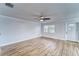 Living room features wood floors and a ceiling fan at 401 Dorchester Pl # 52, Sun City Center, FL 33573