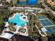 Community pool and tennis courts aerial view at 401 Dorchester Pl # 52, Sun City Center, FL 33573