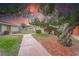 Paved walkway meanders through landscaped condo community at 401 Dorchester Pl # 52, Sun City Center, FL 33573