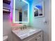 Modern bathroom with LED mirror and marble vanity at 4611 W North B St # 129, Tampa, FL 33609