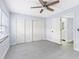 Bedroom with three-door closet and access to bathroom at 4611 W North B St # 129, Tampa, FL 33609