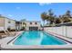 Sparkling community pool surrounded by lush landscaping at 4611 W North B St # 129, Tampa, FL 33609