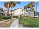 The Vineyard Condominium building, featuring a landscaped walkway and parking at 4611 W North B St # 129, Tampa, FL 33609