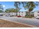 Street view of the Vineyard Condominium building, with cars parked along the road at 4611 W North B St # 129, Tampa, FL 33609