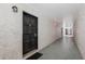 Interior hallway with dark wood doors and light-colored walls at 4611 W North B St # 129, Tampa, FL 33609
