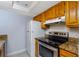 Kitchen with stainless steel appliances and wood cabinets at 4611 W North B St # 129, Tampa, FL 33609