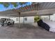 Covered carport parking with additional uncovered parking at 4611 W North B St # 129, Tampa, FL 33609