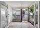 Cozy screened porch with tile flooring and access to backyard at 4611 W North B St # 129, Tampa, FL 33609