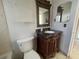 Bathroom features vanity with granite countertop and a toilet at 4617 49Th N Ave, St Petersburg, FL 33714