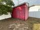 Red storage shed in backyard at 4617 49Th N Ave, St Petersburg, FL 33714