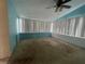 Sunroom with light blue walls and carpeted floors at 4617 49Th N Ave, St Petersburg, FL 33714