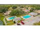 Raintree Lakes community pool area with surrounding landscaping at 6012 Laketree Ln # A, Temple Terrace, FL 33617