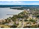 Wide aerial view of waterfront homes, neighborhood, and calm waters at 605 Shore E Dr, Oldsmar, FL 34677
