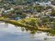 Aerial view showing waterfront park, neighborhood, and calm waters at 605 Shore E Dr, Oldsmar, FL 34677