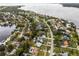 Aerial view showcasing waterfront property, neighborhood, and nearby waterways at 605 Shore E Dr, Oldsmar, FL 34677