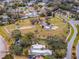 Aerial view of waterfront community with park and neighborhood amenities at 605 Shore E Dr, Oldsmar, FL 34677