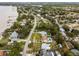 Aerial view of waterfront homes and community, showcasing surrounding landscape at 605 Shore E Dr, Oldsmar, FL 34677