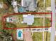 Aerial view showing house and large backyard at 605 Shore E Dr, Oldsmar, FL 34677