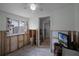 Unfinished bedroom with window, ceiling fan, and access to hallway at 605 Shore E Dr, Oldsmar, FL 34677
