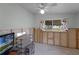 Unfinished bedroom with window, ceiling fan, and wall-mounted TV at 605 Shore E Dr, Oldsmar, FL 34677
