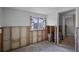 Unfinished bedroom with window, ceiling fan, and access to hallway at 605 Shore E Dr, Oldsmar, FL 34677
