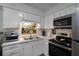 Updated kitchen with stainless steel appliances at 605 Shore E Dr, Oldsmar, FL 34677