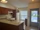 Kitchen with granite island and breakfast bar at 665 Rodeo Dr, Largo, FL 33771