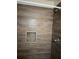 Shower with wood-look tile and a single shower head at 665 Rodeo Dr, Largo, FL 33771