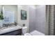 Clean bathroom with shower stall, granite vanity, and updated fixtures at 6724 Broad River Ave, Land O Lakes, FL 34638