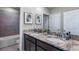 Double vanity bathroom with granite countertops and walk-in shower at 6724 Broad River Ave, Land O Lakes, FL 34638