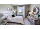 Guest bedroom with a queen-size bed and neutral decor at 6724 Broad River Ave, Land O Lakes, FL 34638