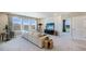 Bonus room showcases sectional sofa, media console, and window views at 6724 Broad River Ave, Land O Lakes, FL 34638