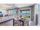 Dining room with sliding glass doors leading to a patio overlooking a lake at 6724 Broad River Ave, Land O Lakes, FL 34638