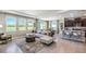Open-concept living room with kitchen and lake view at 6724 Broad River Ave, Land O Lakes, FL 34638