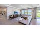 Living room with a large sectional sofa and a view of the lake at 6724 Broad River Ave, Land O Lakes, FL 34638