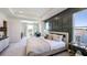 Main bedroom features a king-size bed, sitting area, and large windows at 6724 Broad River Ave, Land O Lakes, FL 34638
