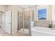 Bathroom featuring a shower, soaking tub, and modern finishes at 6732 Broad River Ave, Land O Lakes, FL 34638